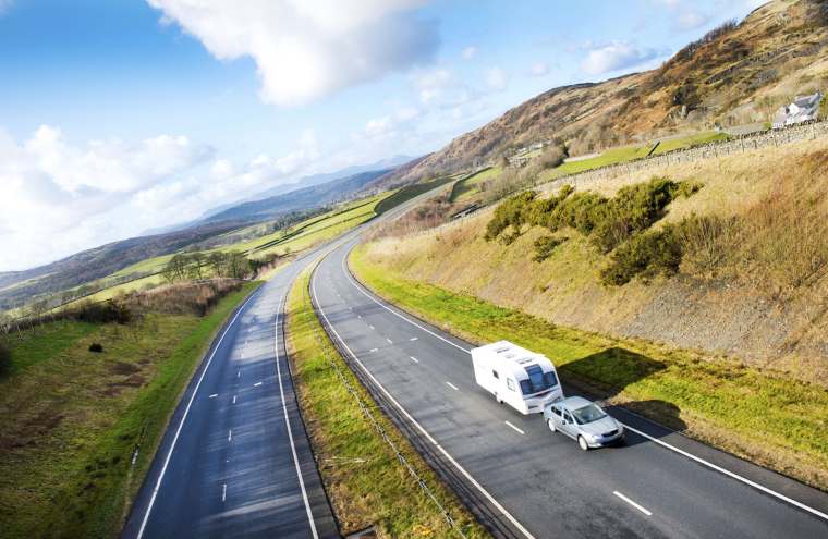 caravan and car on open road