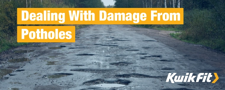 Potholes on the road in the countryside.