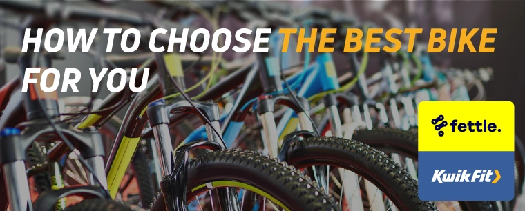 Row of different coloured bicycles lined up side by side.