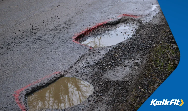 Two big potholes on a UK road.