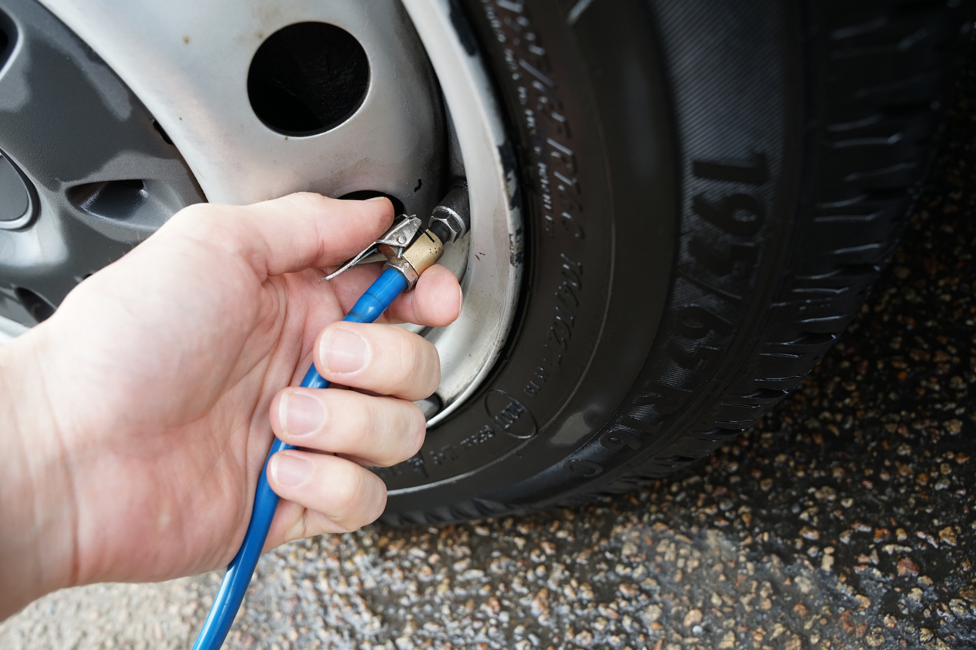 Person removing tyre valves.