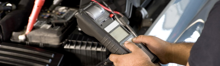 mechanic using diagnostic machine