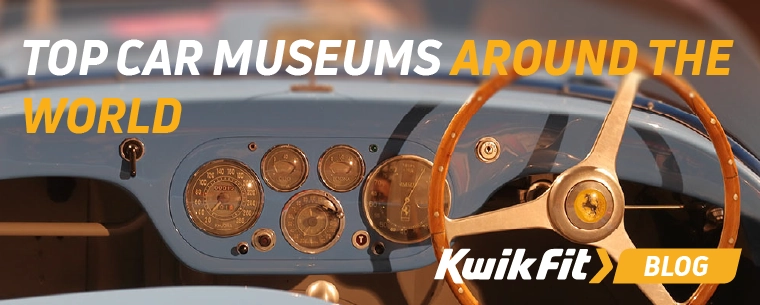 The steering wheel and dashboard of a classic Ferrari.