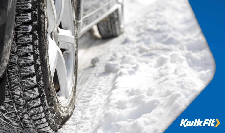 Car tyres cover in snow.